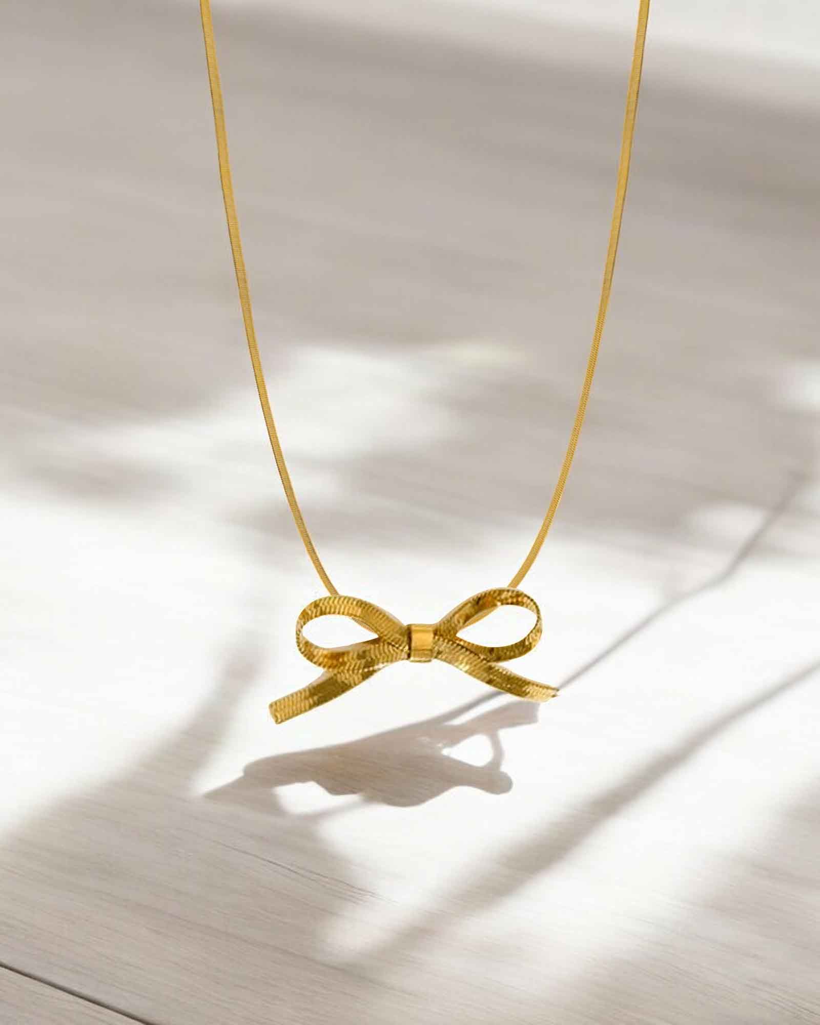 Bow tie pendant necklace