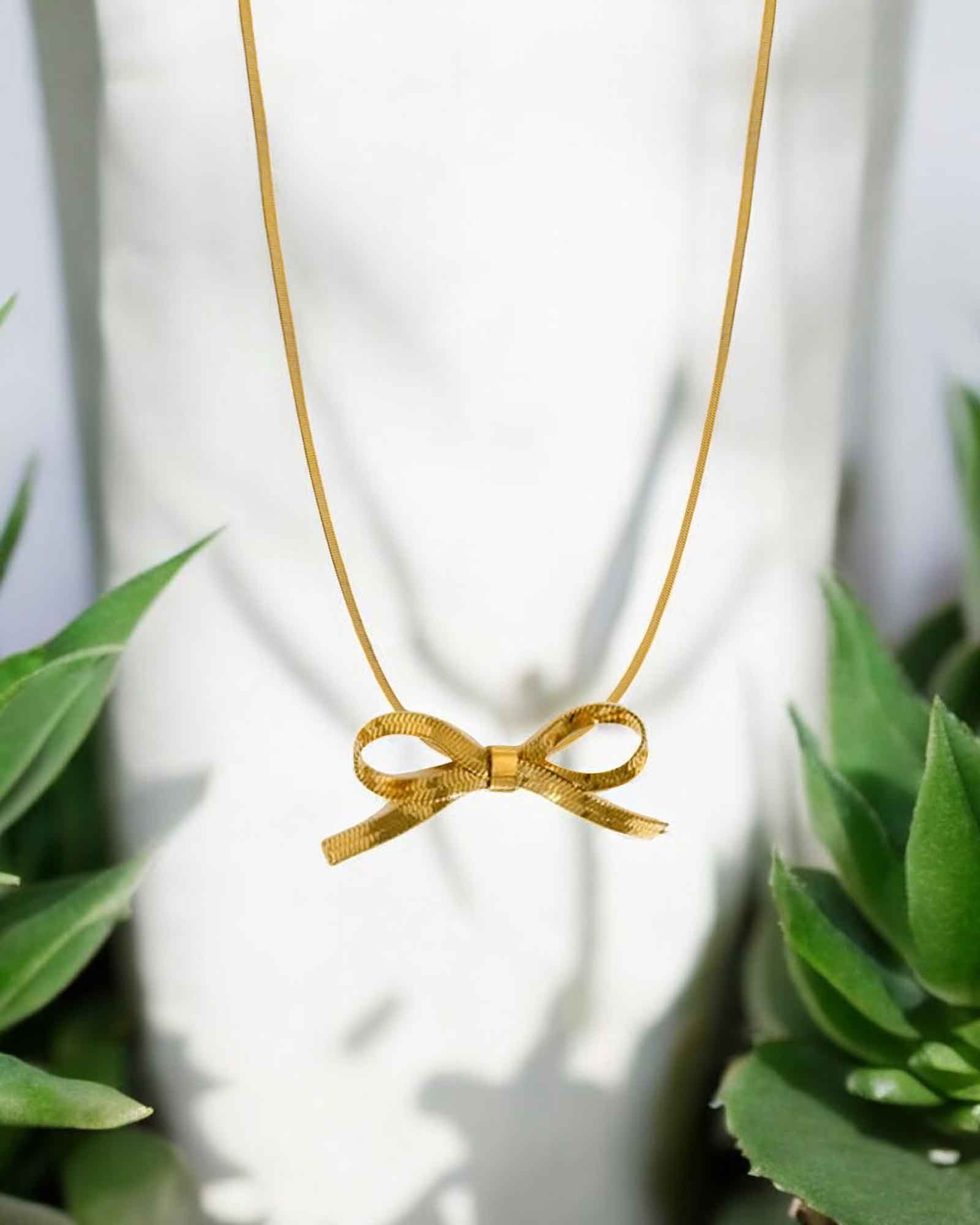 Bow tie pendant necklace